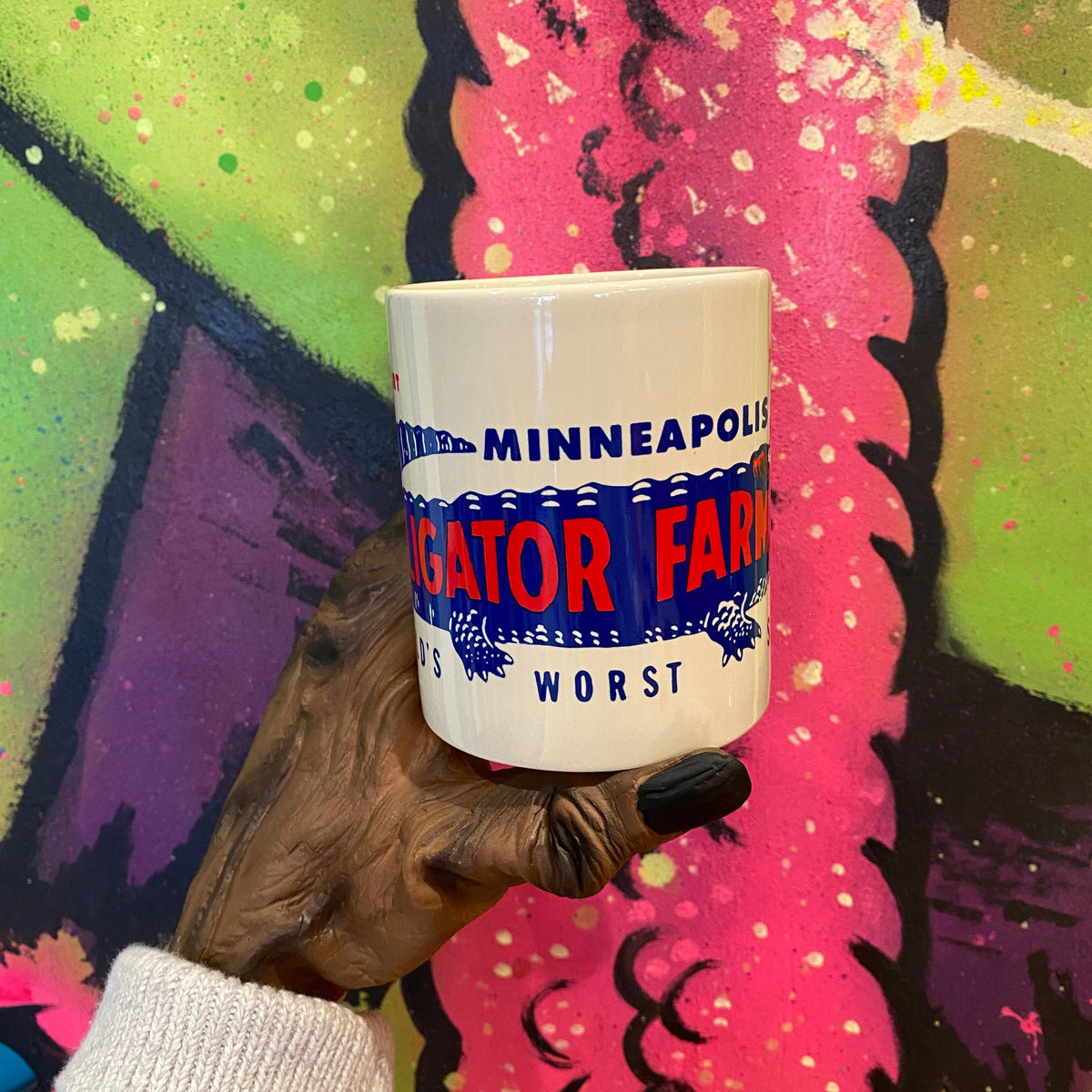 a monster hand holds the product as described 